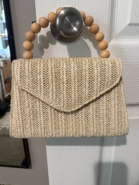 Small tan woven handbag